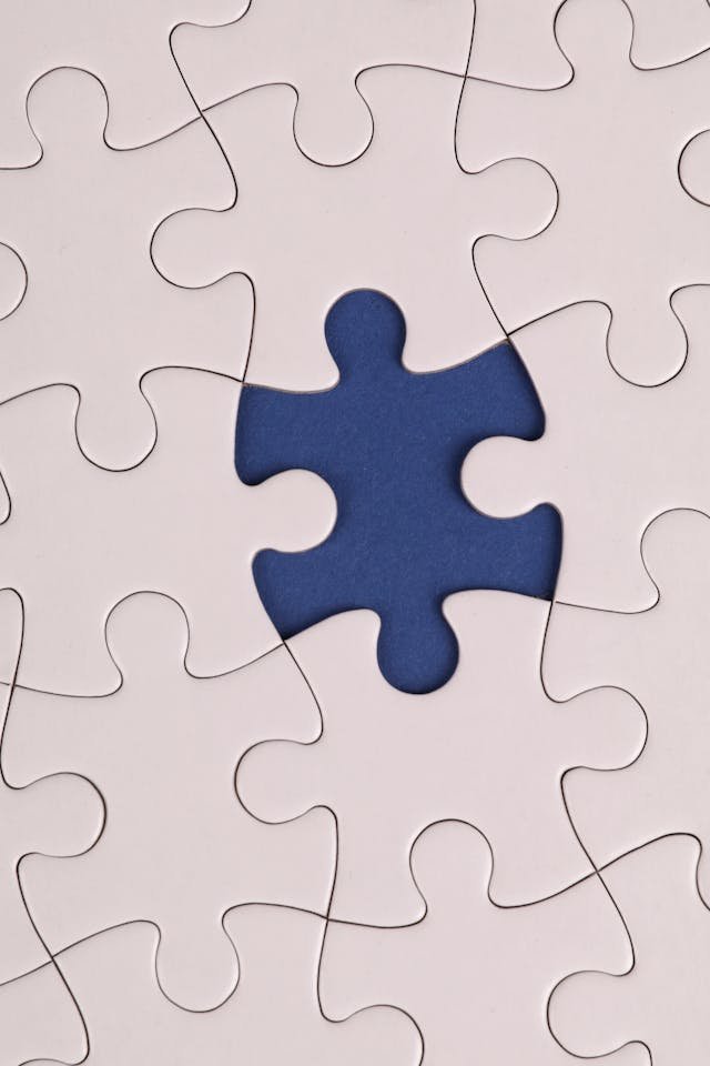 A plain completed jigsaw puzzle with a piece missing