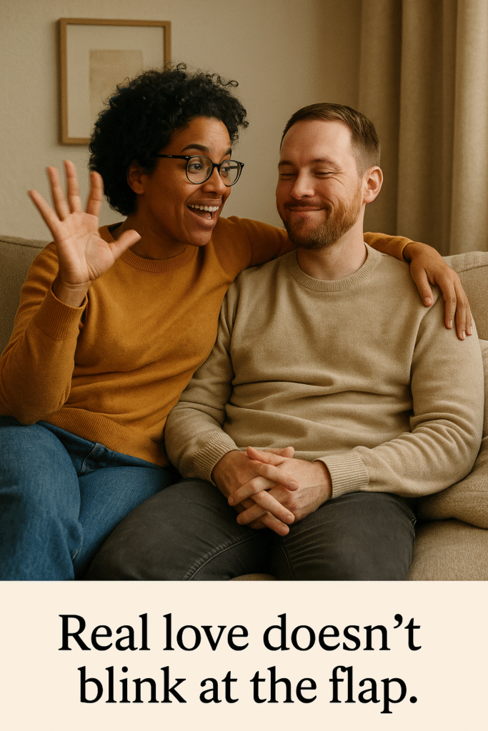 An AI Image Two people cuddled on a sofa, one flapping their hand mid-conversation, the other unfazed — caption: “Real love doesn’t blink at the flap