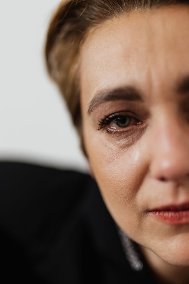 A close up image of a woman crying 