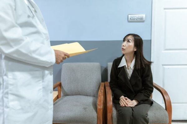 A woman eagerly awaiting results from a doctor just approaching her