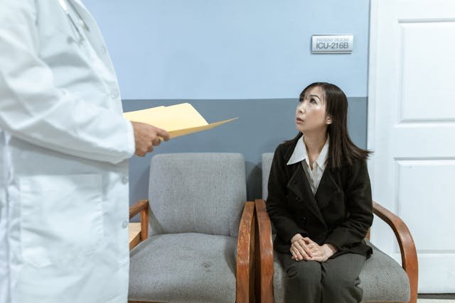 A woman eagerly awaiting results from a doctor just approaching her